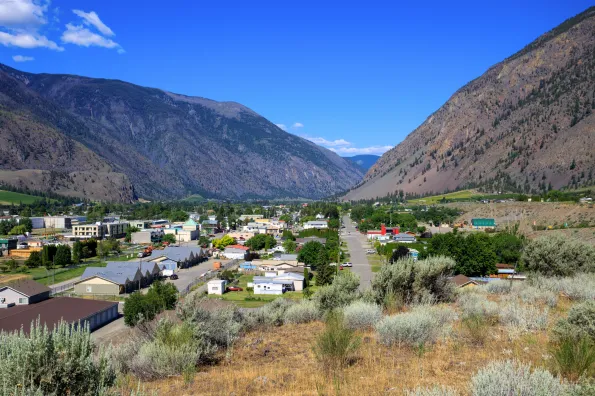 A view overlooking a town between two mountains